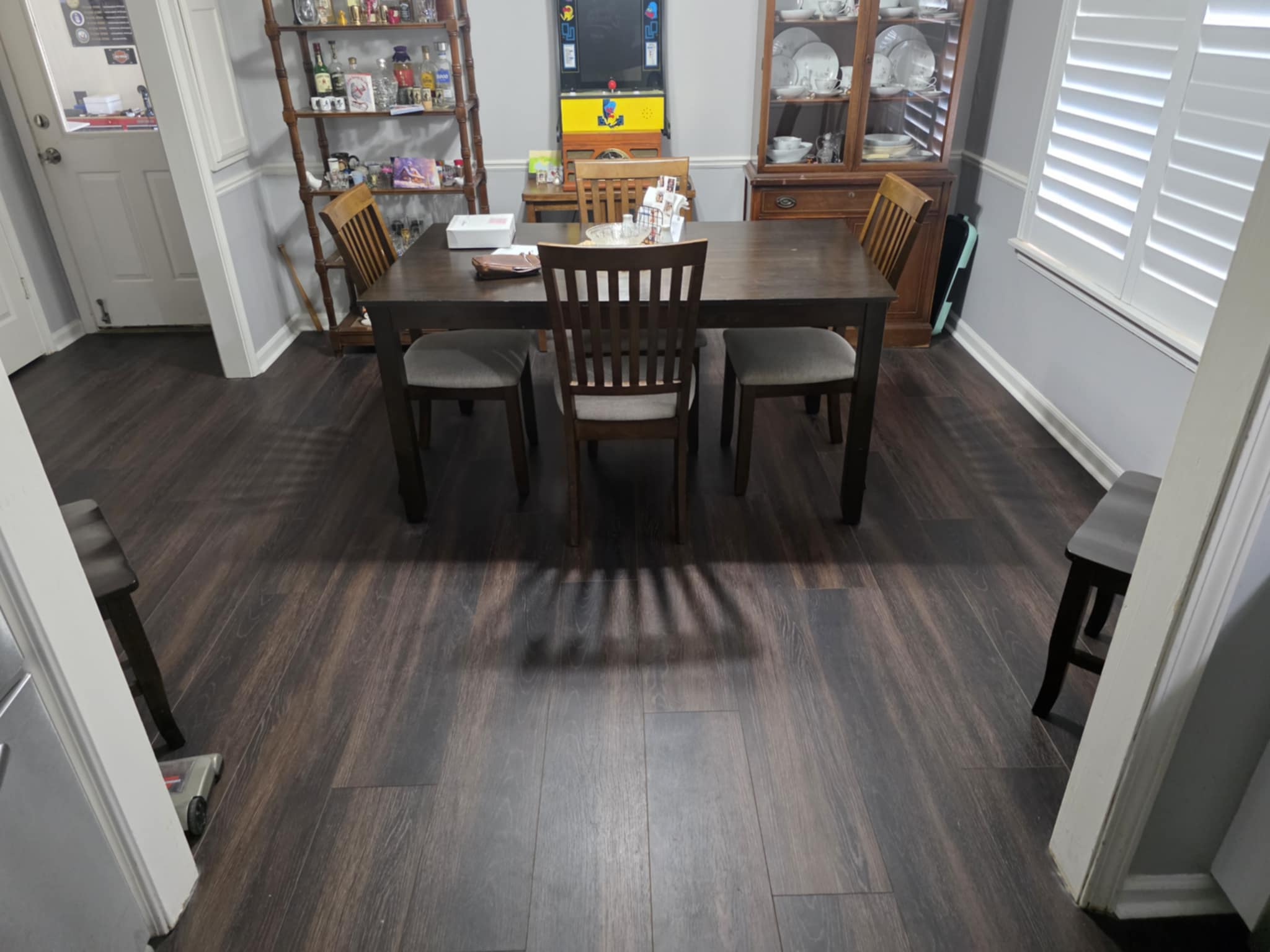 Dining room with newly installed dark flooring