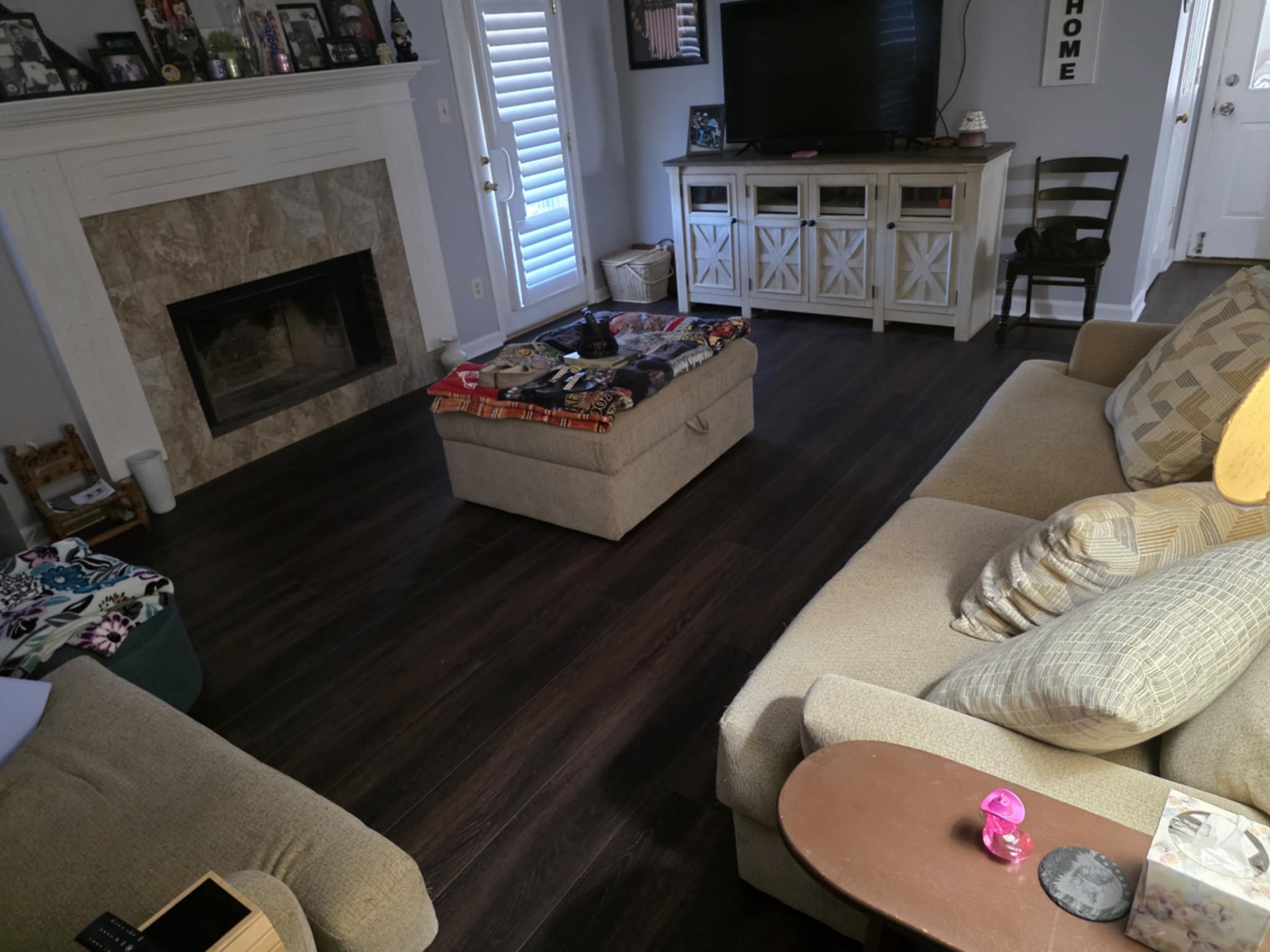 Living room with newly installed dark flooring